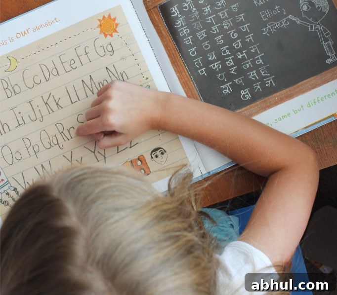 Girl reading a book about the alphabets in different cultures