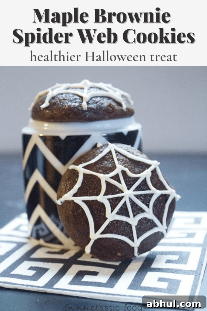 Halloween maple brownie cookies with spiderweb icing