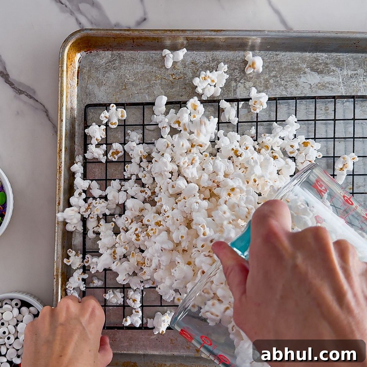 Sifting the popcorn.