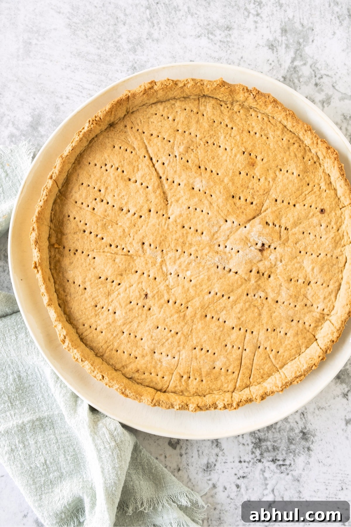 Top down view of gluten-free dairy-free graham cracker crust on plate.