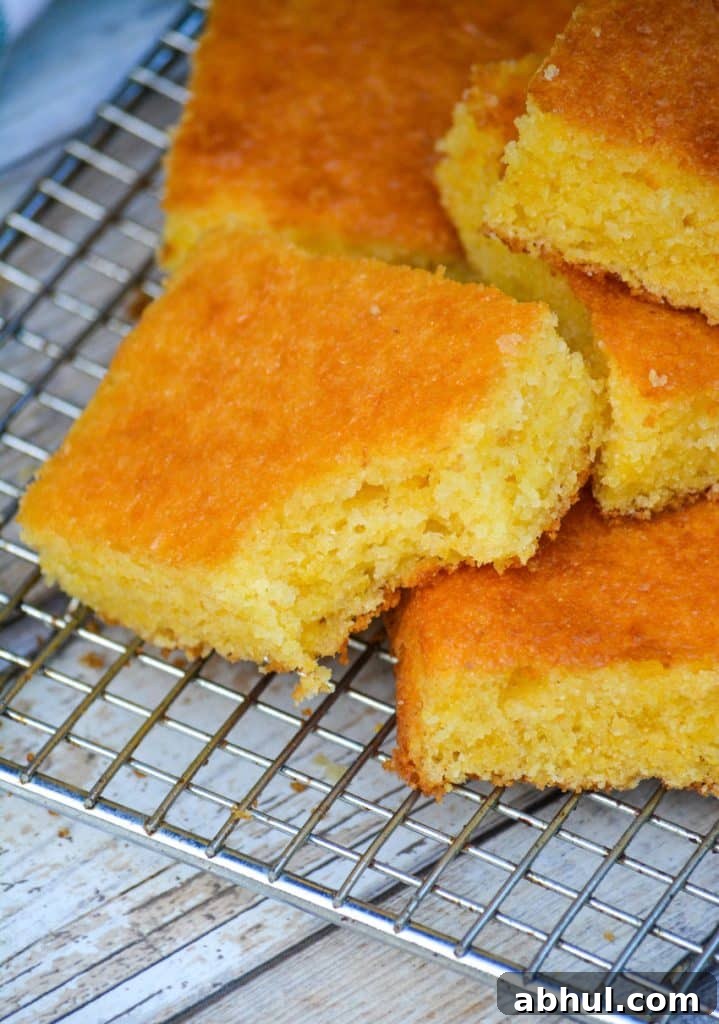 Make Moister Cornbread from a Box 5 a slice of golden cornbread with a bite taken out of one corner
