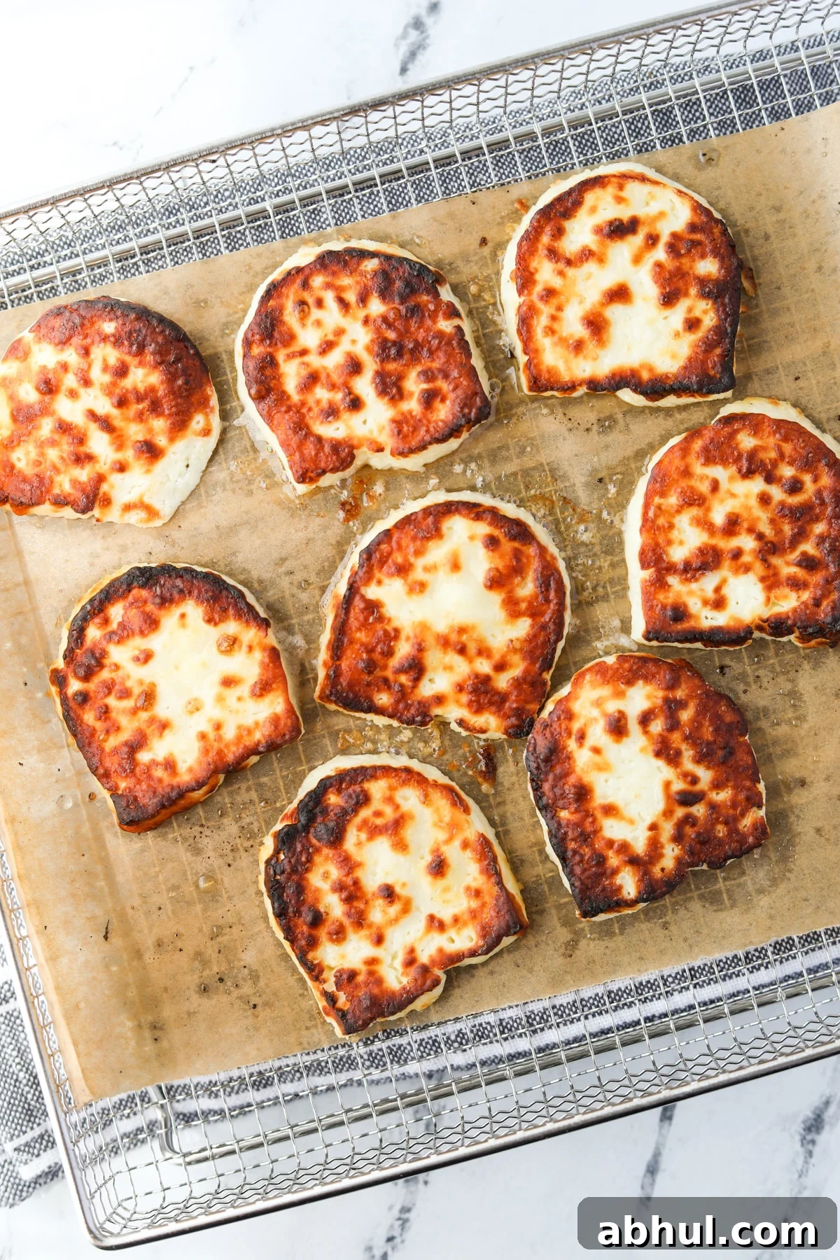 Slices of halloumi cheese that have been air fried.