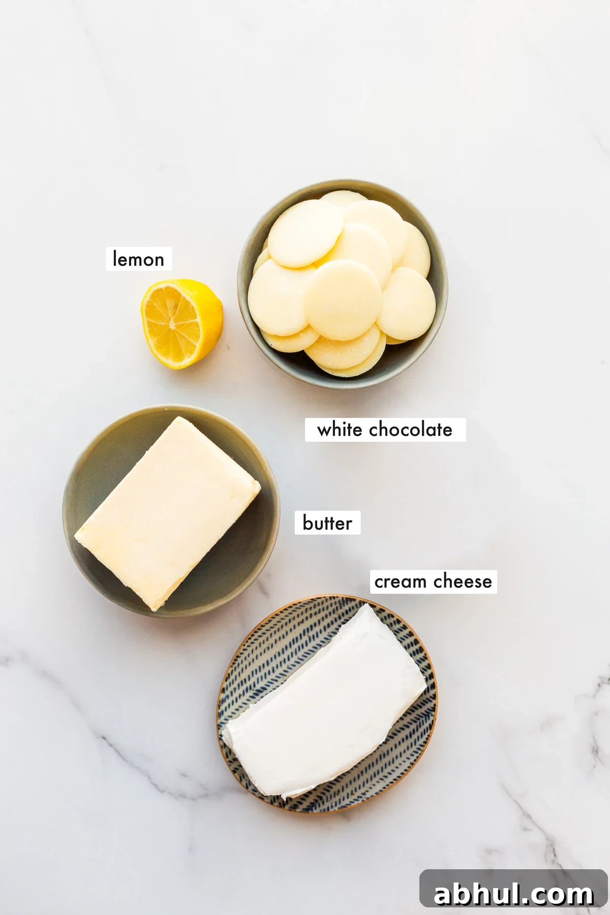 Ingredients to make white chocolate cream cheese frosting.