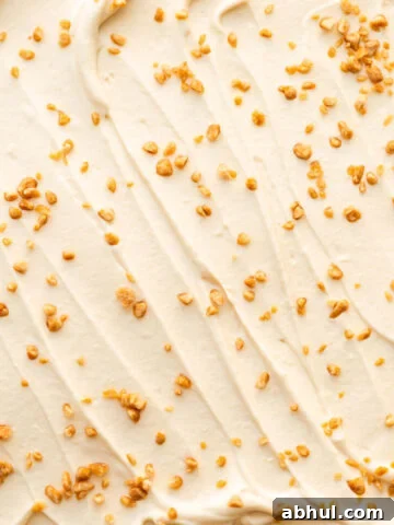 Swirls of maple-flavoured whipped cream with maple flakes sprinkled on top.