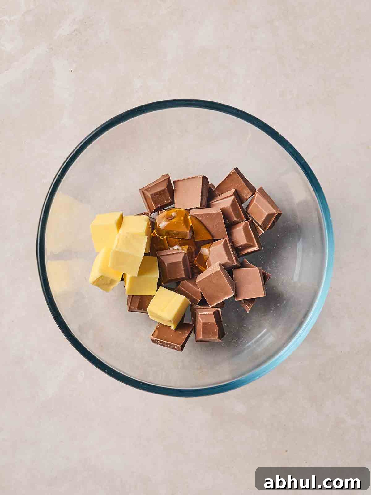 Chocolate, butter and golden syrup in a bowl.