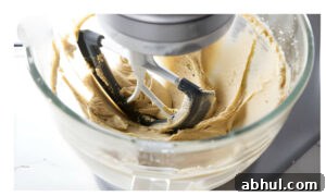 Creaming butter and sugar in a mixing bowl.