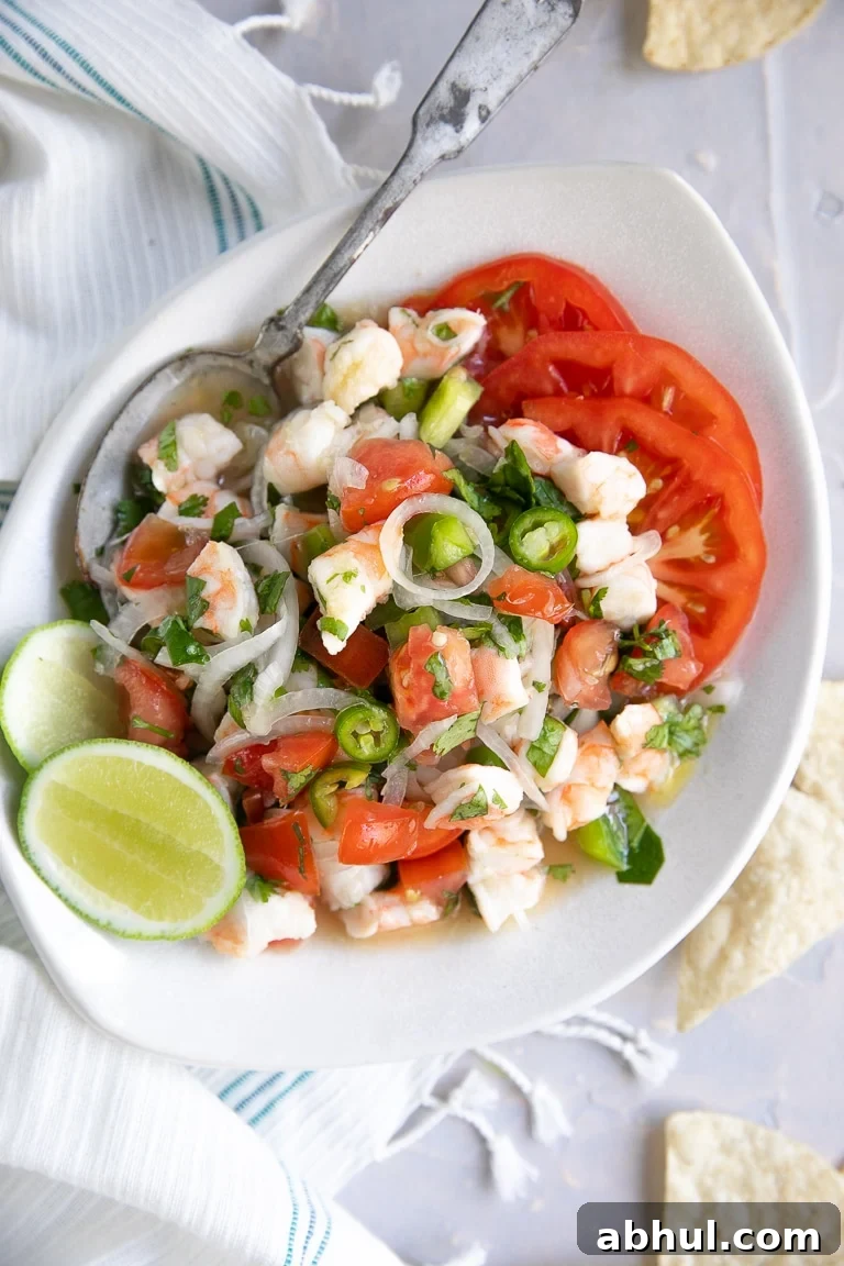 Overhead image of a white serving dish filled with fresh shrimp ceviche.