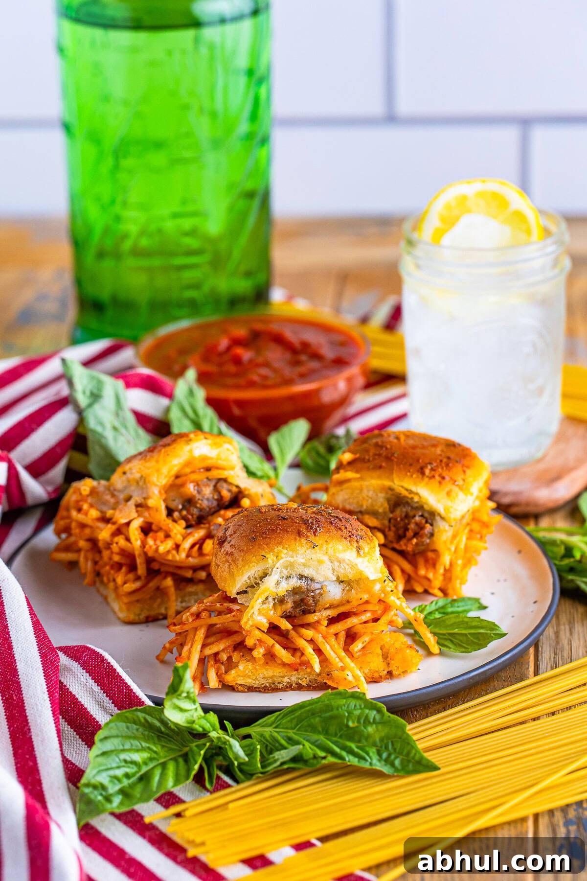Meatball Sliders on a plate with water