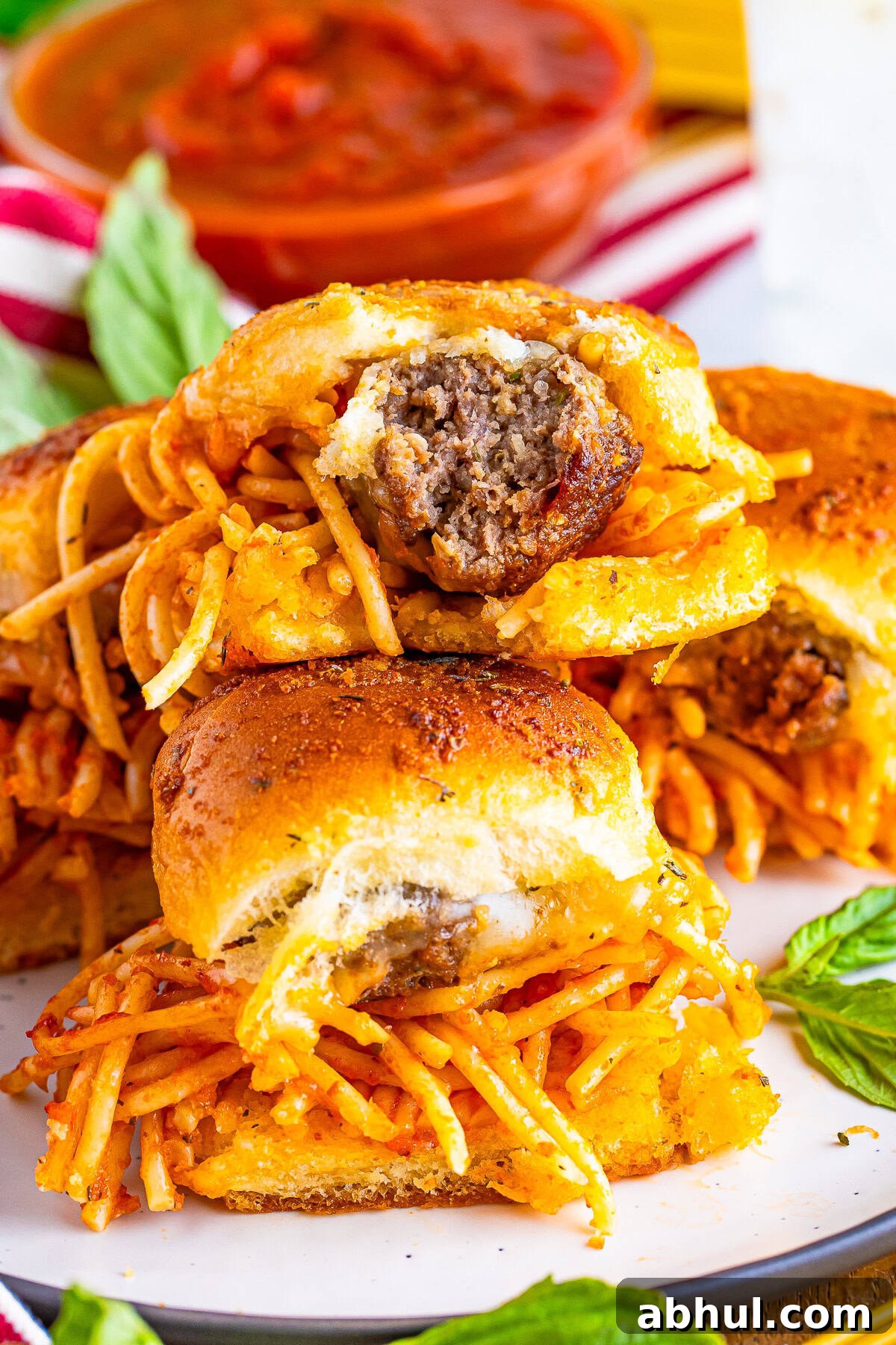 Meatball Sliders stacked with a bite taken out