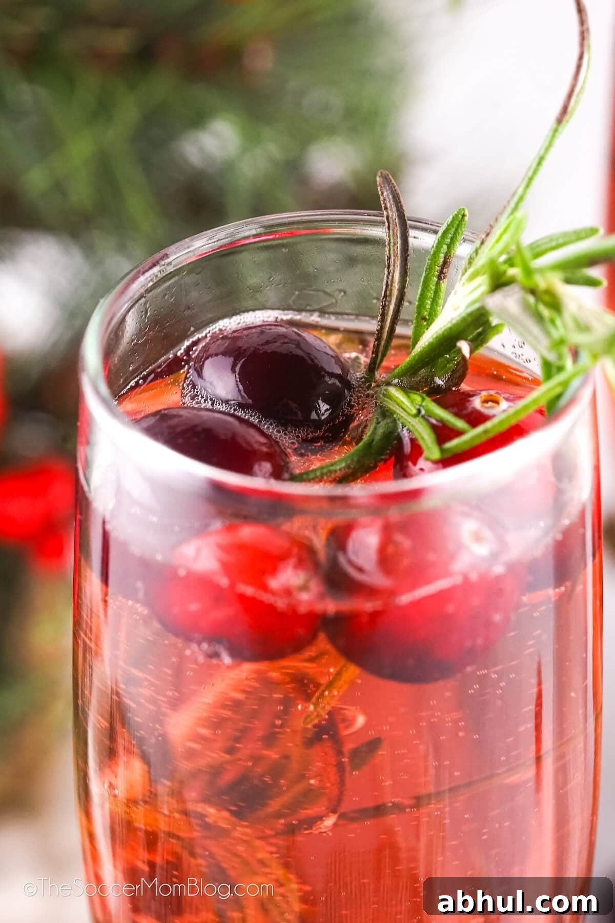 close up of a cranberry mimosa drink.