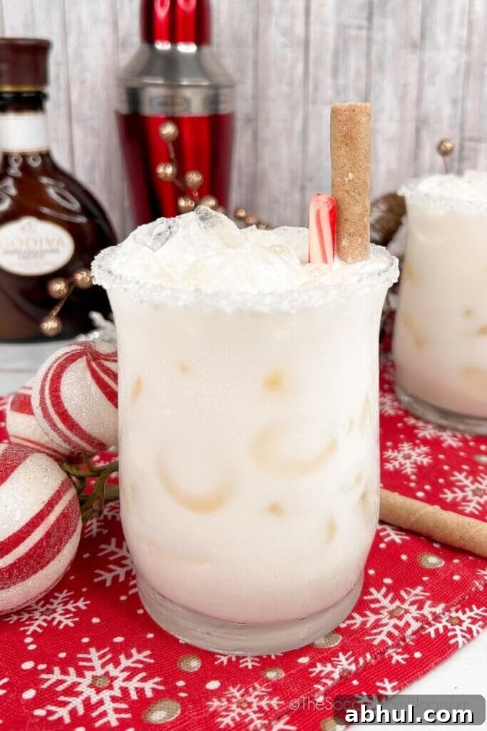 Christmas White Russian, garnished with peppermint sticks.