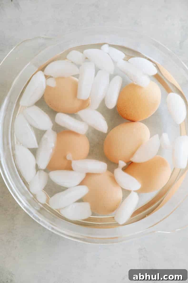 hard boiled eggs cooling in an egg bath.