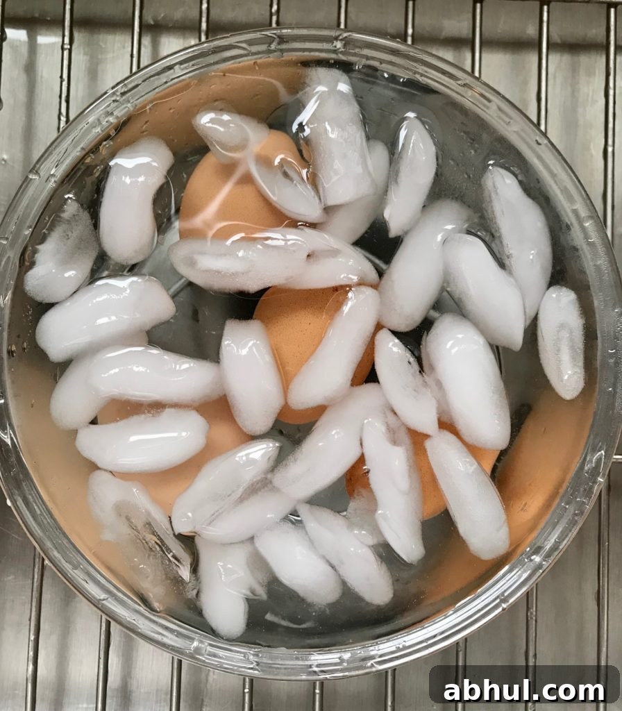 Cool boiled eggs in ice water. 