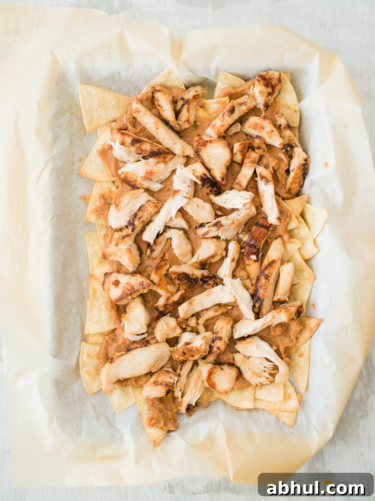 chips beans and chicken layered