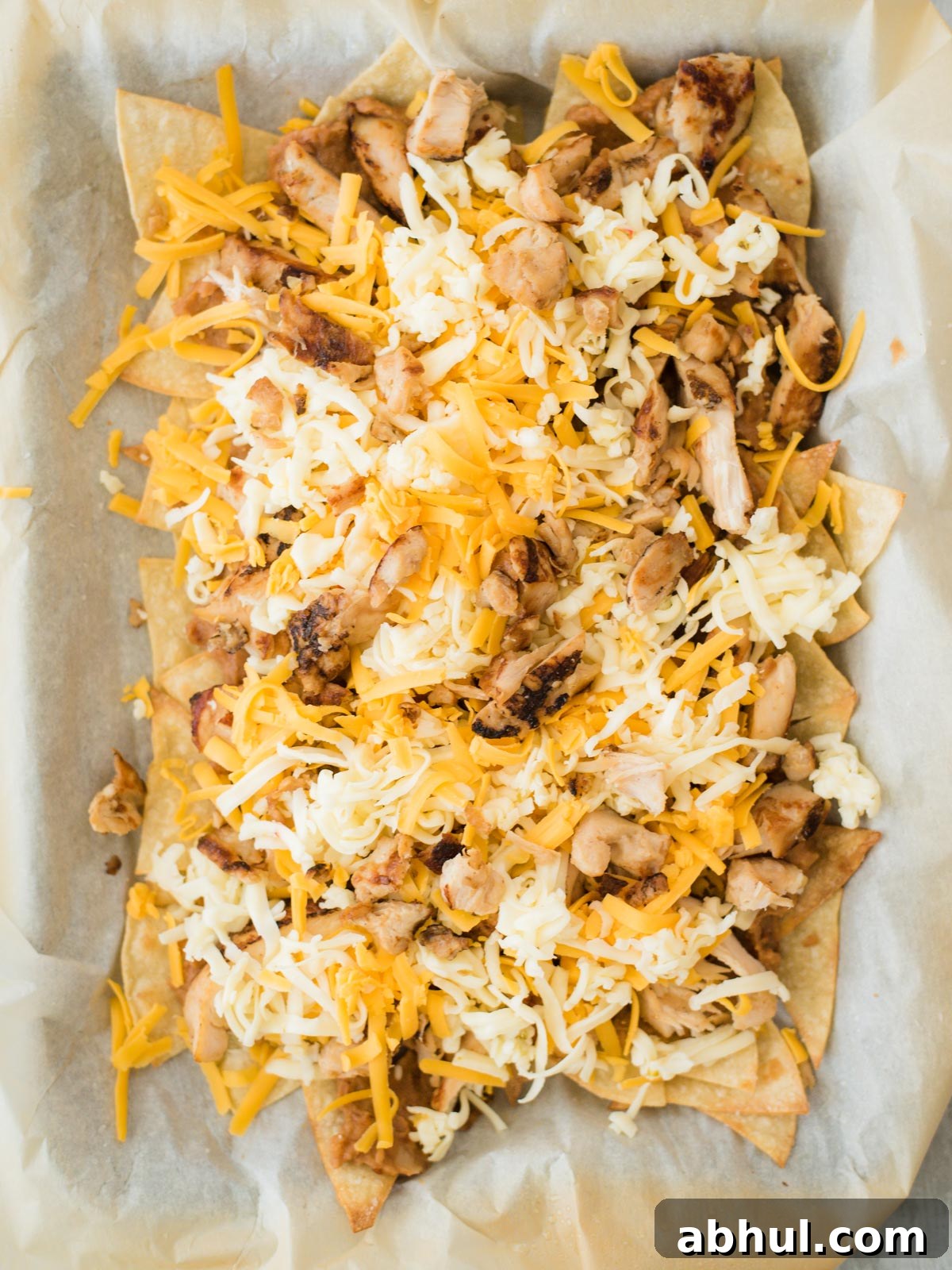 chips chicken beans and cheese layered before melted