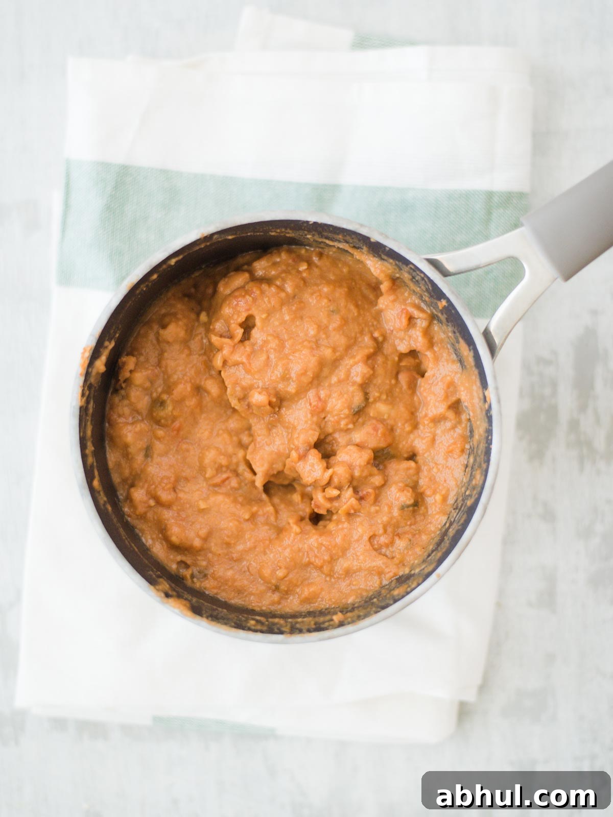 refriend beans in sauce pan