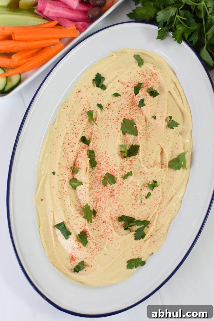 Ground Beef Layered Hummus layered on a plate.