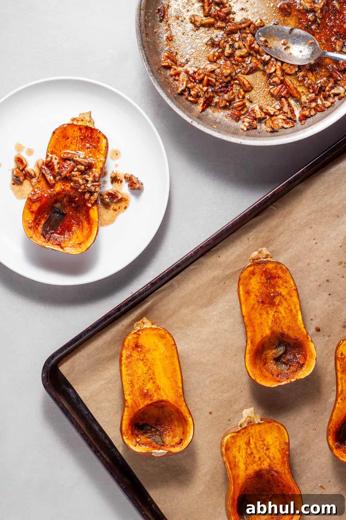 Maple-Pecan Roasted Honeynut Squash Recipe 9 Roasted honeynut squash getting topped with candied maple pecans and sage.