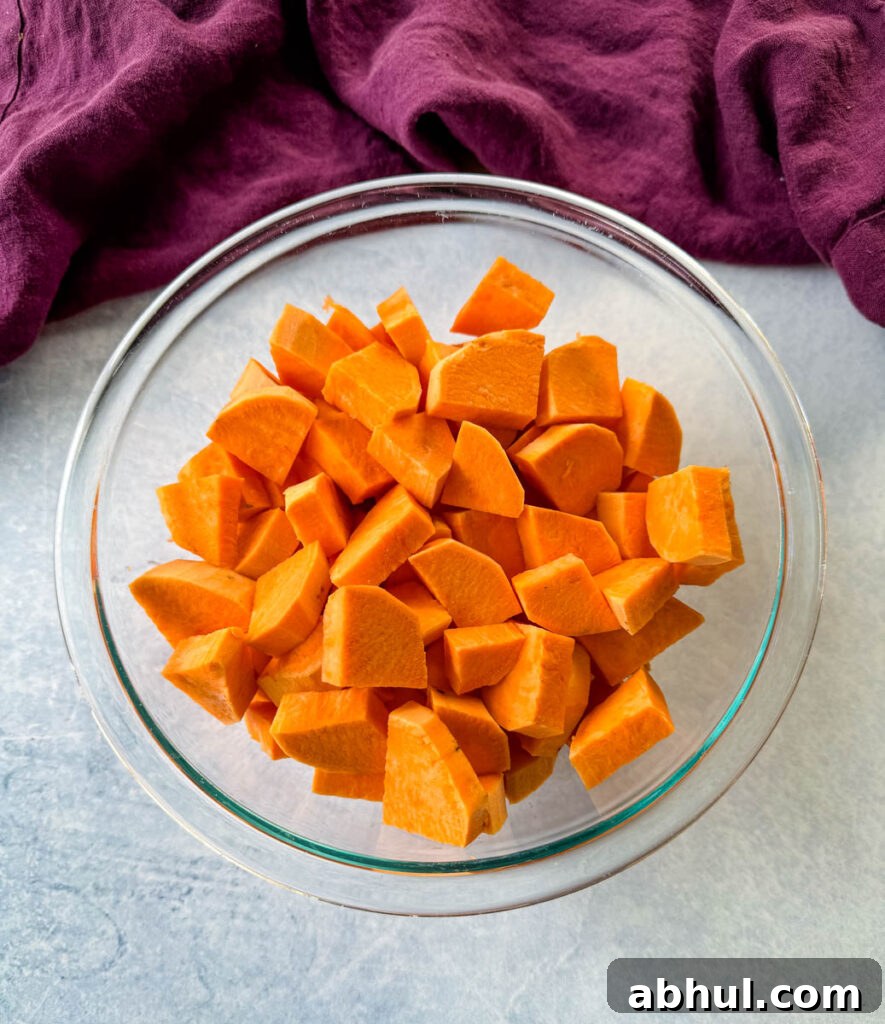 Crispy Fried Sweet Potatoes with Honey and Cinnamon 4 diced sweet potatoes in a glass bowl