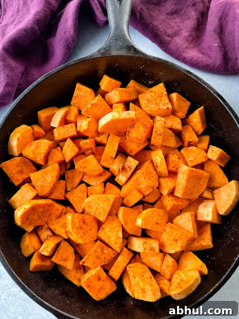 Crispy Fried Sweet Potatoes with Honey and Cinnamon 7 uncooked sweet potatoes in a cast iron skillet