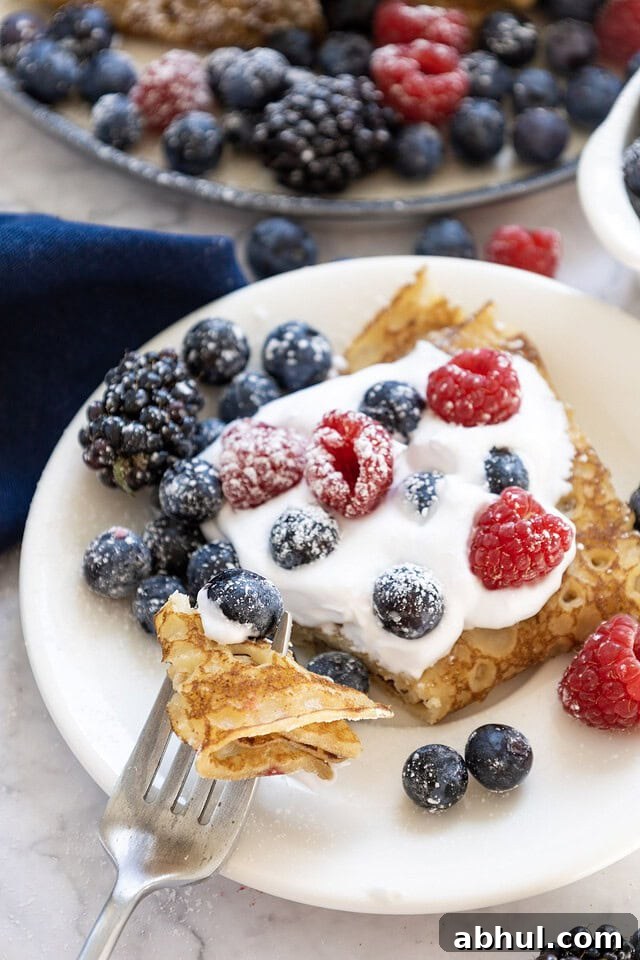 Crepes with whipped cream and berries