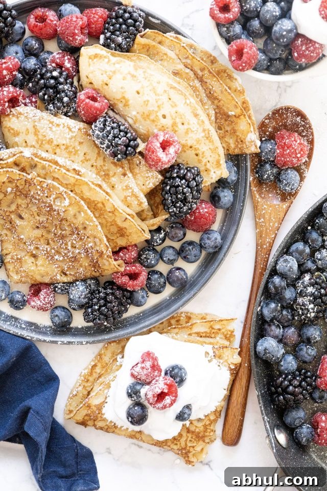 Crepes with whipped cream and berries