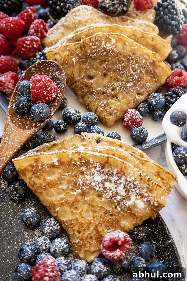 Crepes with whipped cream and berries