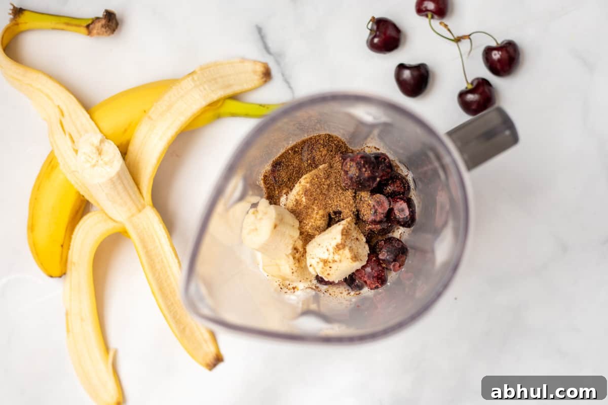 Ingredients for Cherry Smoothie in blender.