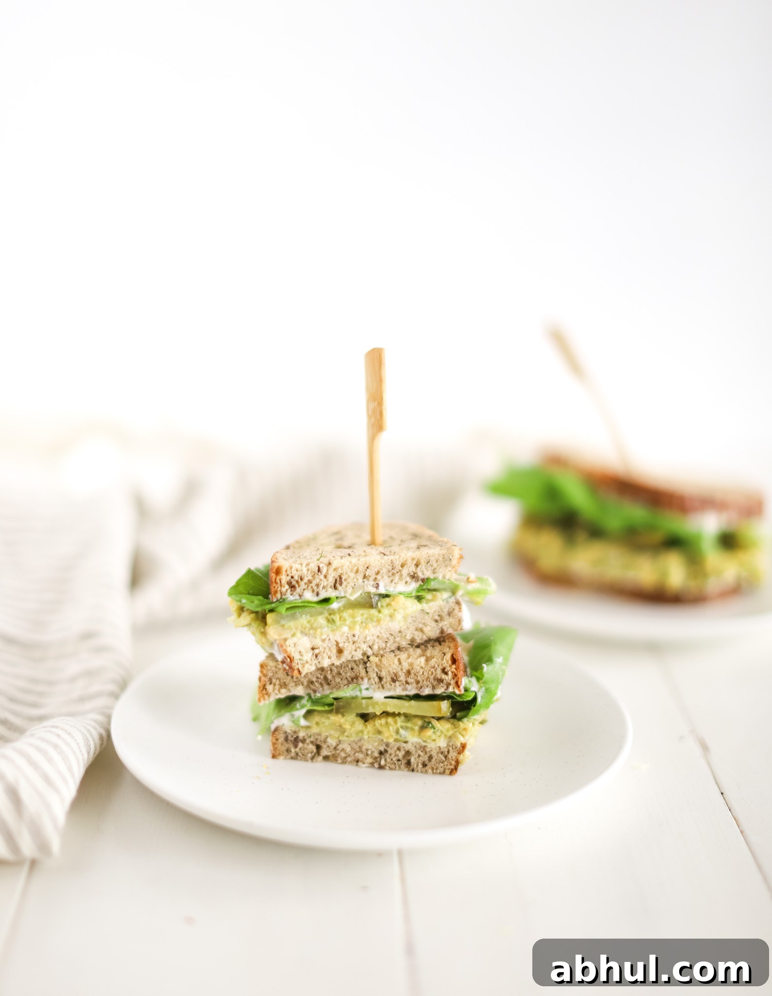chickpea avocado sandwich cut in half