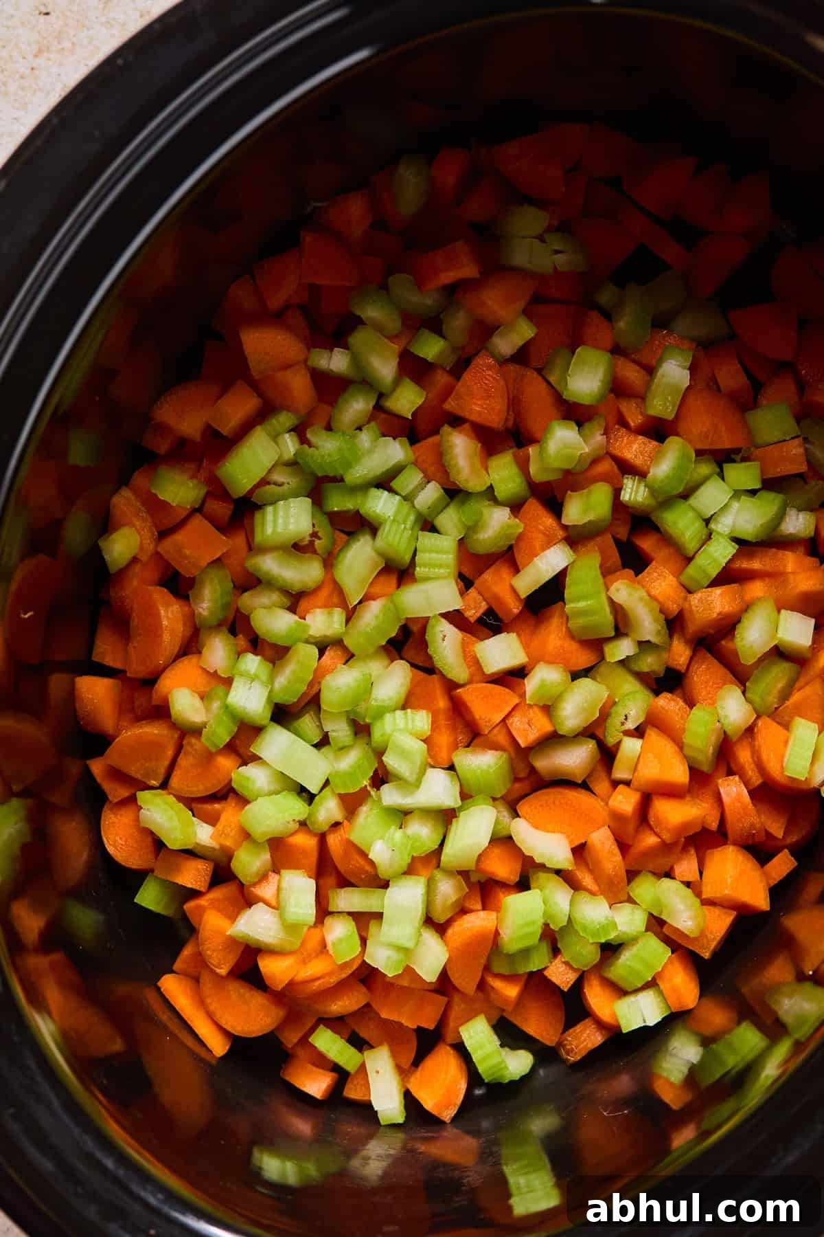 Carrots and celery added to crockpot.