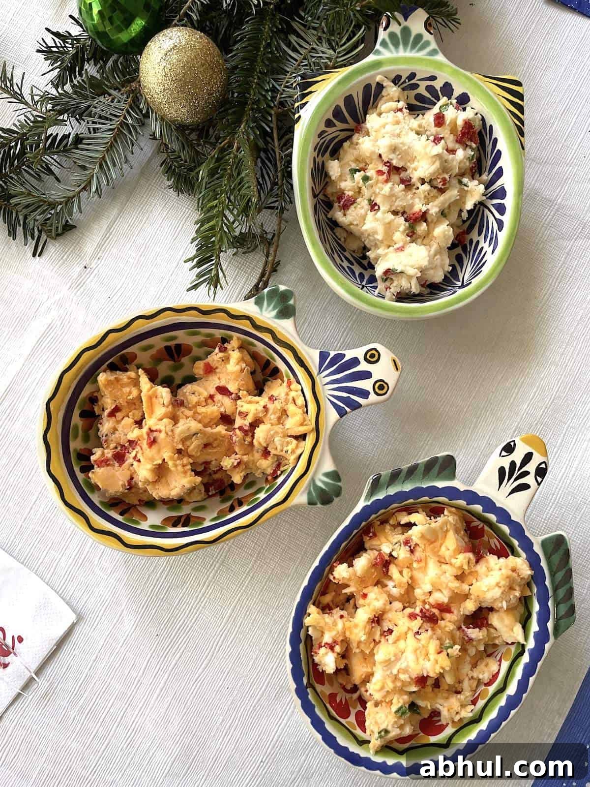 Three turtle shaped bowls with homemade pimento cheese in them.