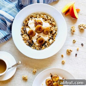 air fried bananas in a bowl with yogurt and granola next to bananas and nectarines