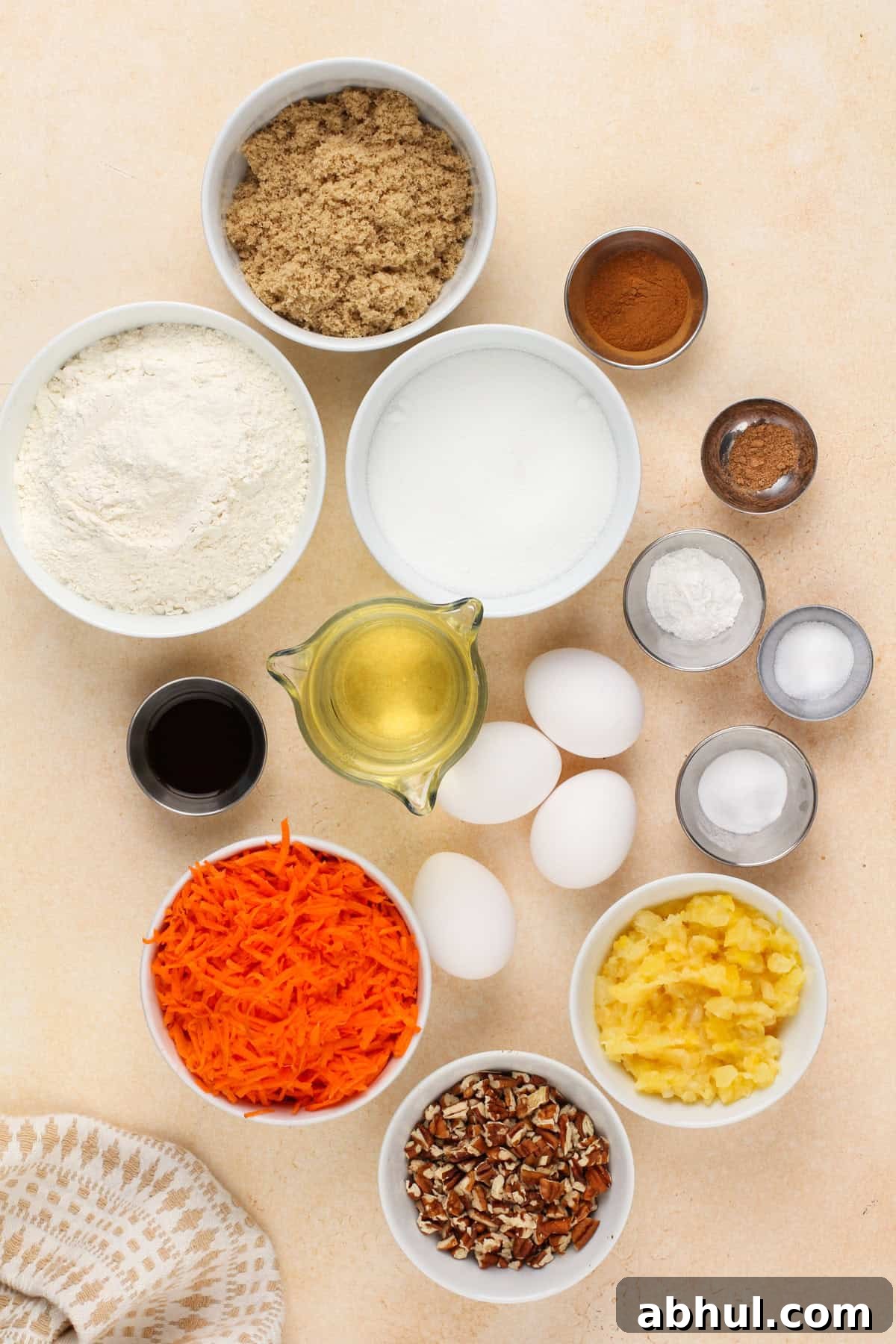 Carrot cake bar ingredients arranged on a countertop.