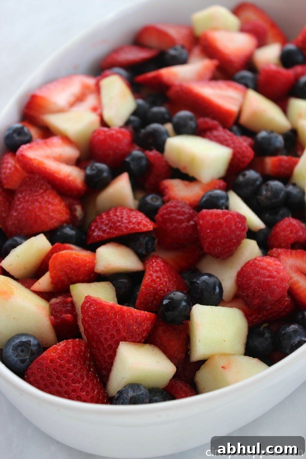 Patriotic Red, White & Blue Summer Fruit Salad Recipe 3 Red White and Blue Fruit Salad- Perfect for July 4th! Red strawberries, red raspberries, and white apples all mixed with a yummy lime dressing.