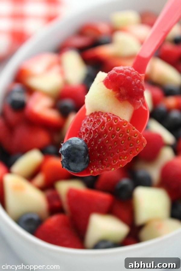 Patriotic Red, White & Blue Summer Fruit Salad Recipe 4 Red White and Blue Fruit Salad- Perfect for July 4th! Red strawberries, red raspberries, and white apples all mixed with a yummy lime dressing.