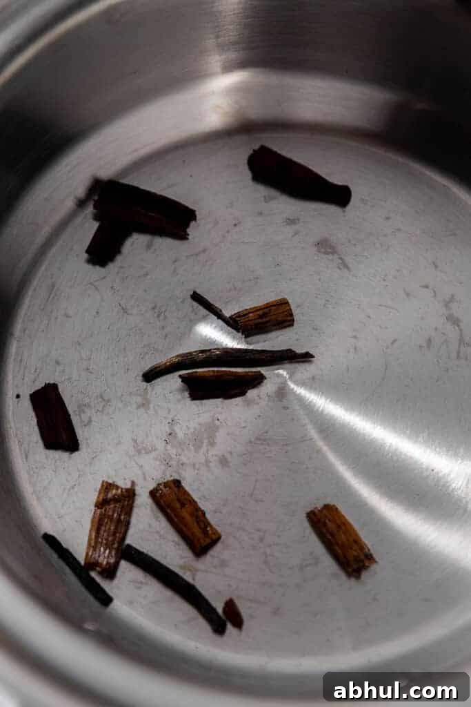 Vanilla beans toasting in a pan