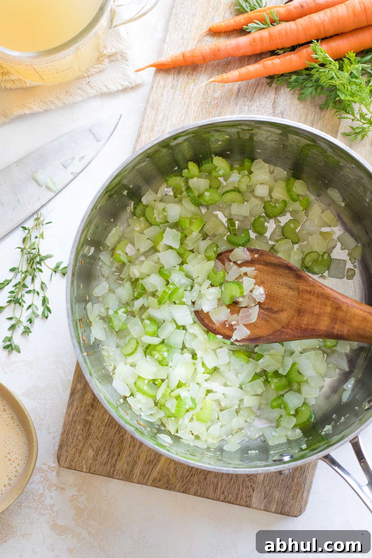 Overhead of celery, onions and garlic in pot after they've cooked.