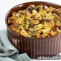 savory bread pudding with gruyere, chanterelles, and leeks in a souffle dish