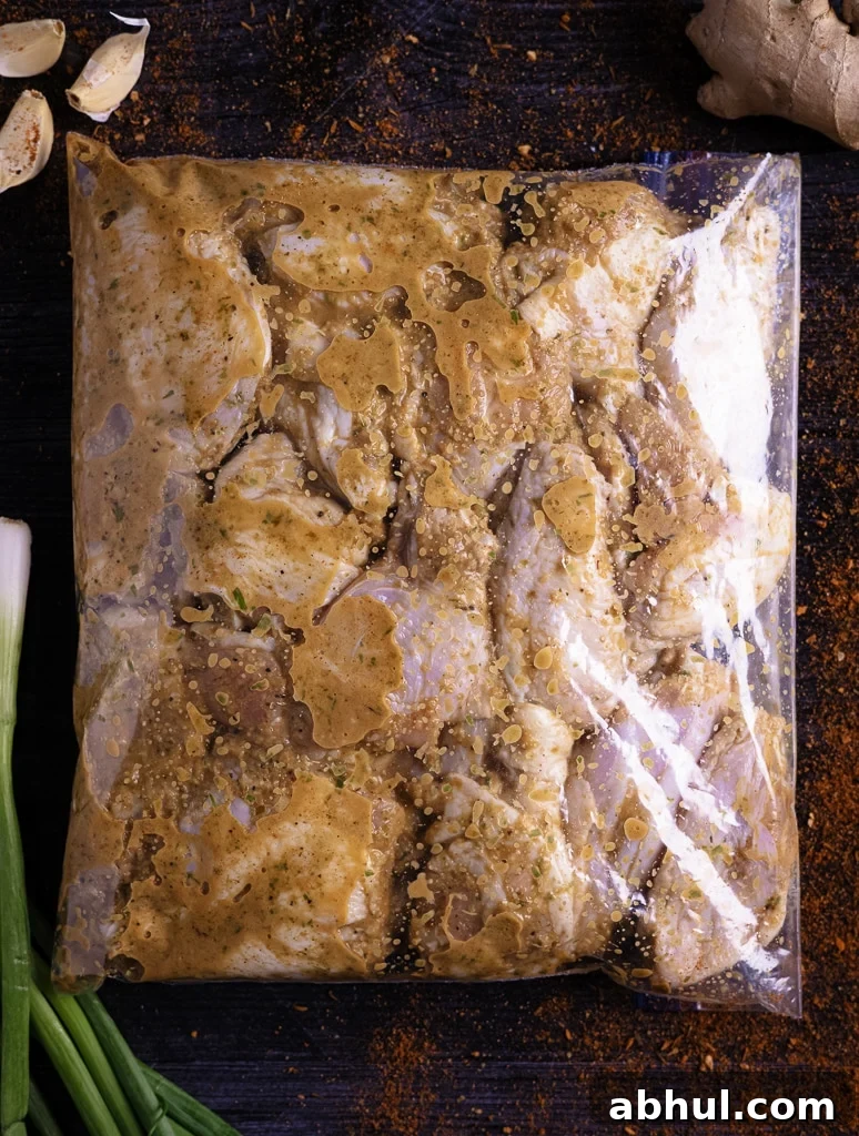 Chicken wings in a jerk chicken marinade.