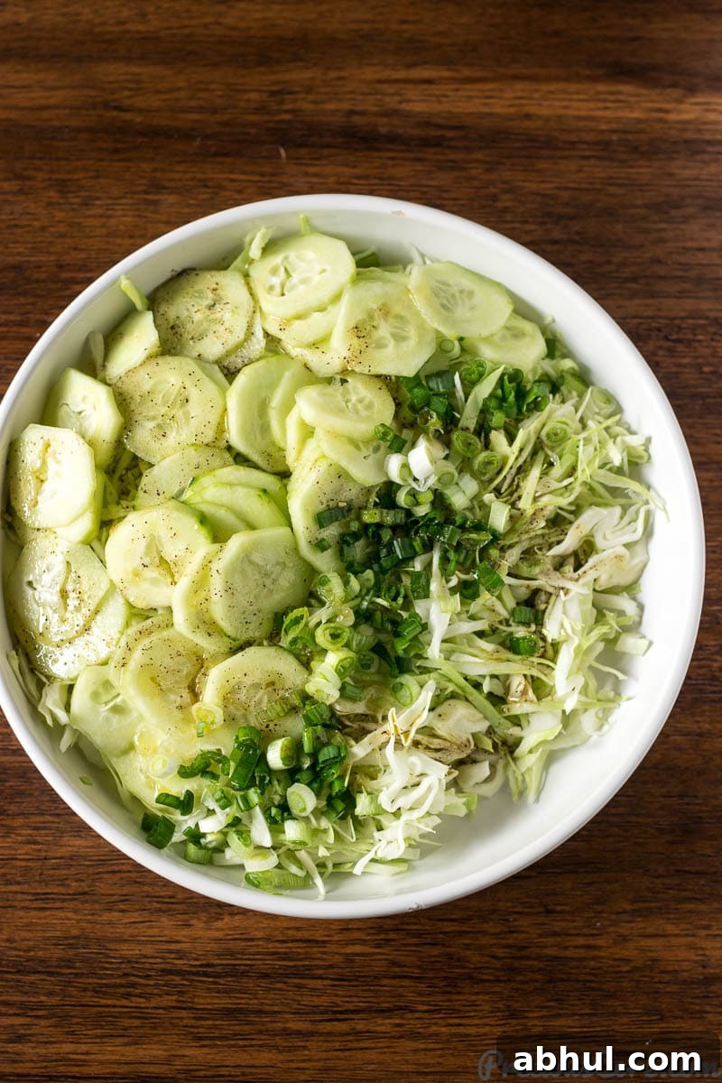 Crisp Cabbage Salad with Tangy Dressing 2 Cabbage Salad in a white bowl.