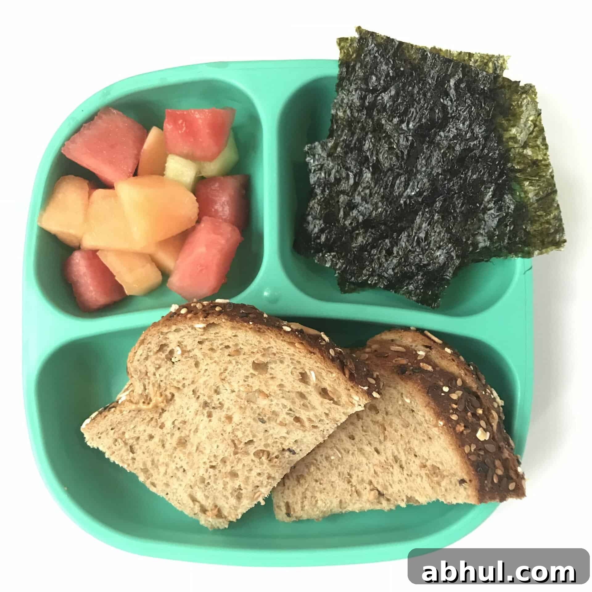 lunch with sandwich and fruit and seaweed chips