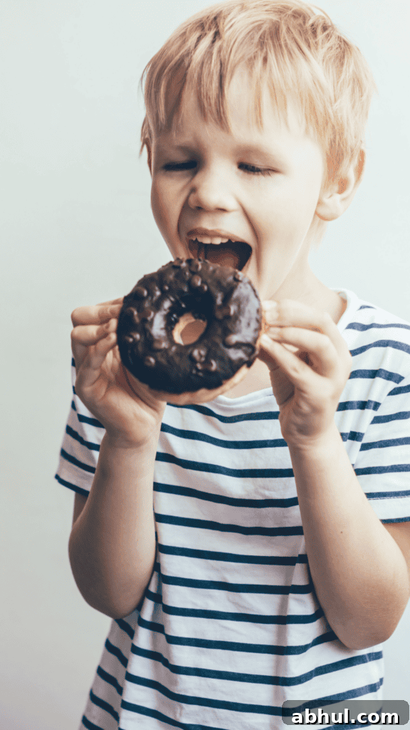 Little Boy Taking a Bite of Donut