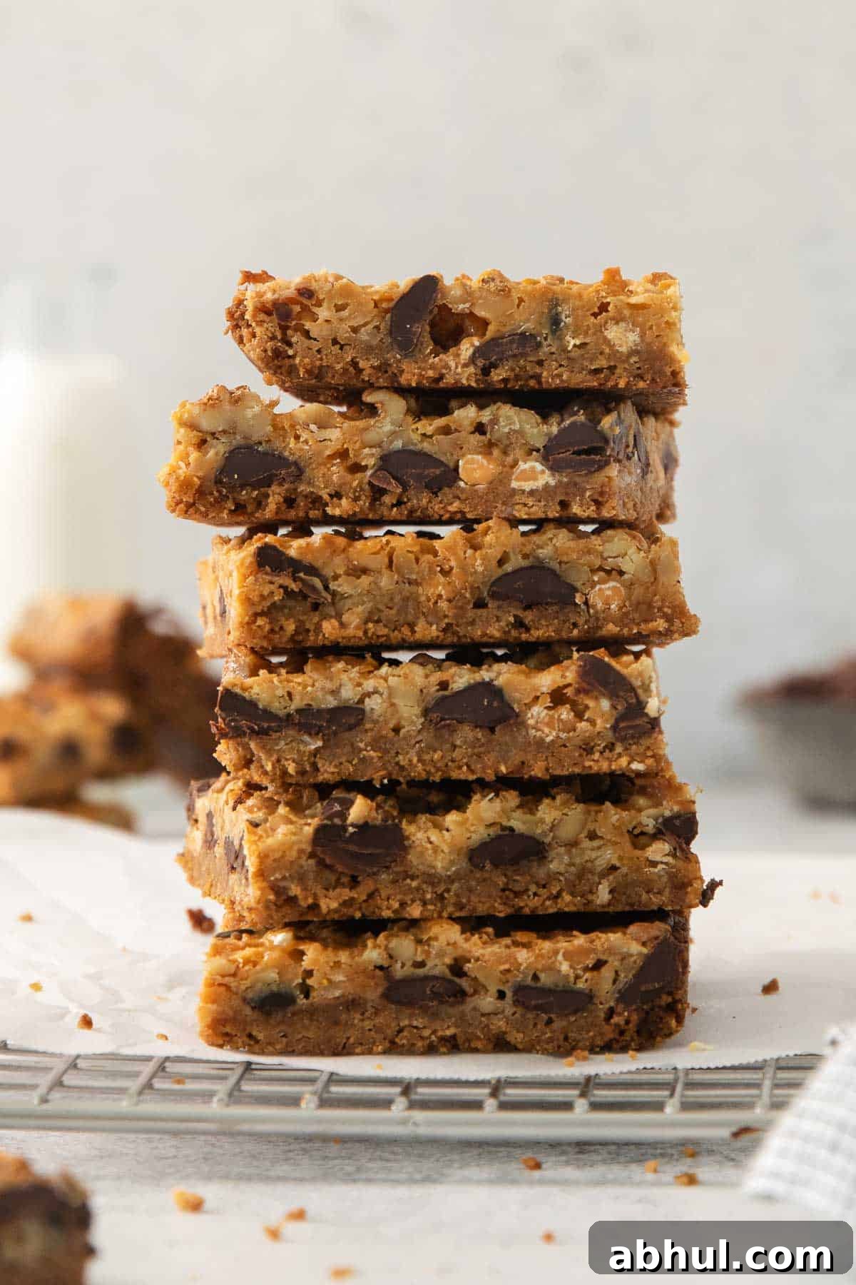 Gluten-Free Seven-Layer Bars Recipe — Chewy Chocolate Coconut Bars 2 7-layer bars stacked on a cooling rack