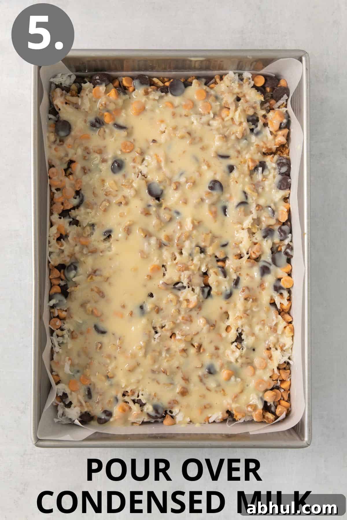 Gluten-Free Seven-Layer Bars Recipe — Chewy Chocolate Coconut Bars 8 Condensed milk poured over the 7-layer bars