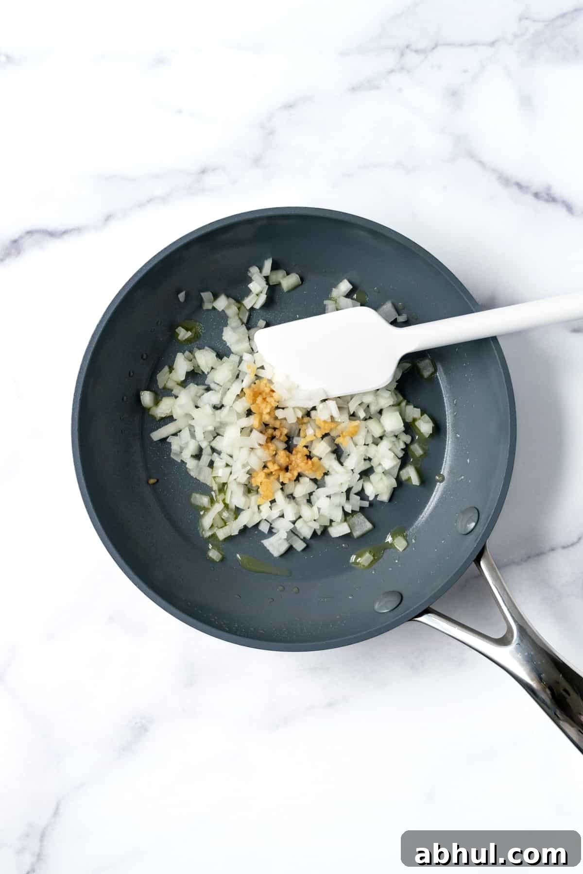 Diced onions and garlic in a small skillet.