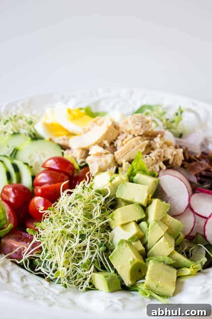 Tuna cobb salad made with fresh veggies, hard boiled eggs, and tuna.