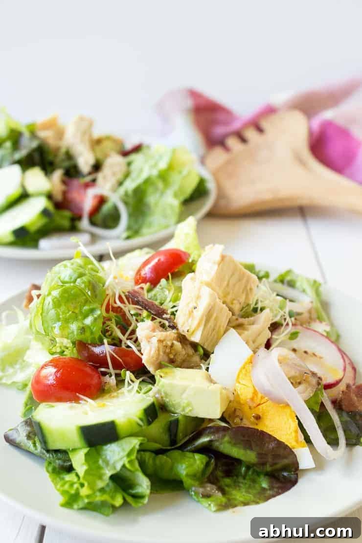 Cobb salad made with tuna and topped with a light vinaigrette dressing