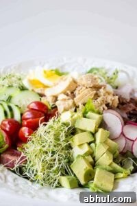 Tuna cobb salad made with fresh veggies, hard boiled eggs, and tuna.