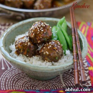 Pineapple Ssy glazed beef meatballs with rice and snow peas.