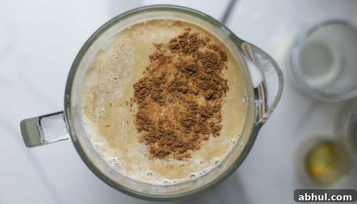 eggs, milk, cream, cinnamon and more in a blender.